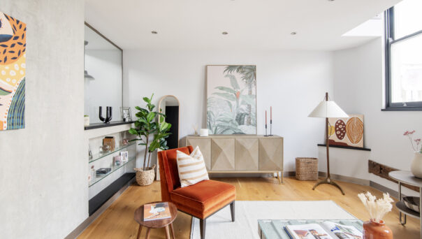 Industrial inspired living room of a two-bedroom home for sale on Portobello Road