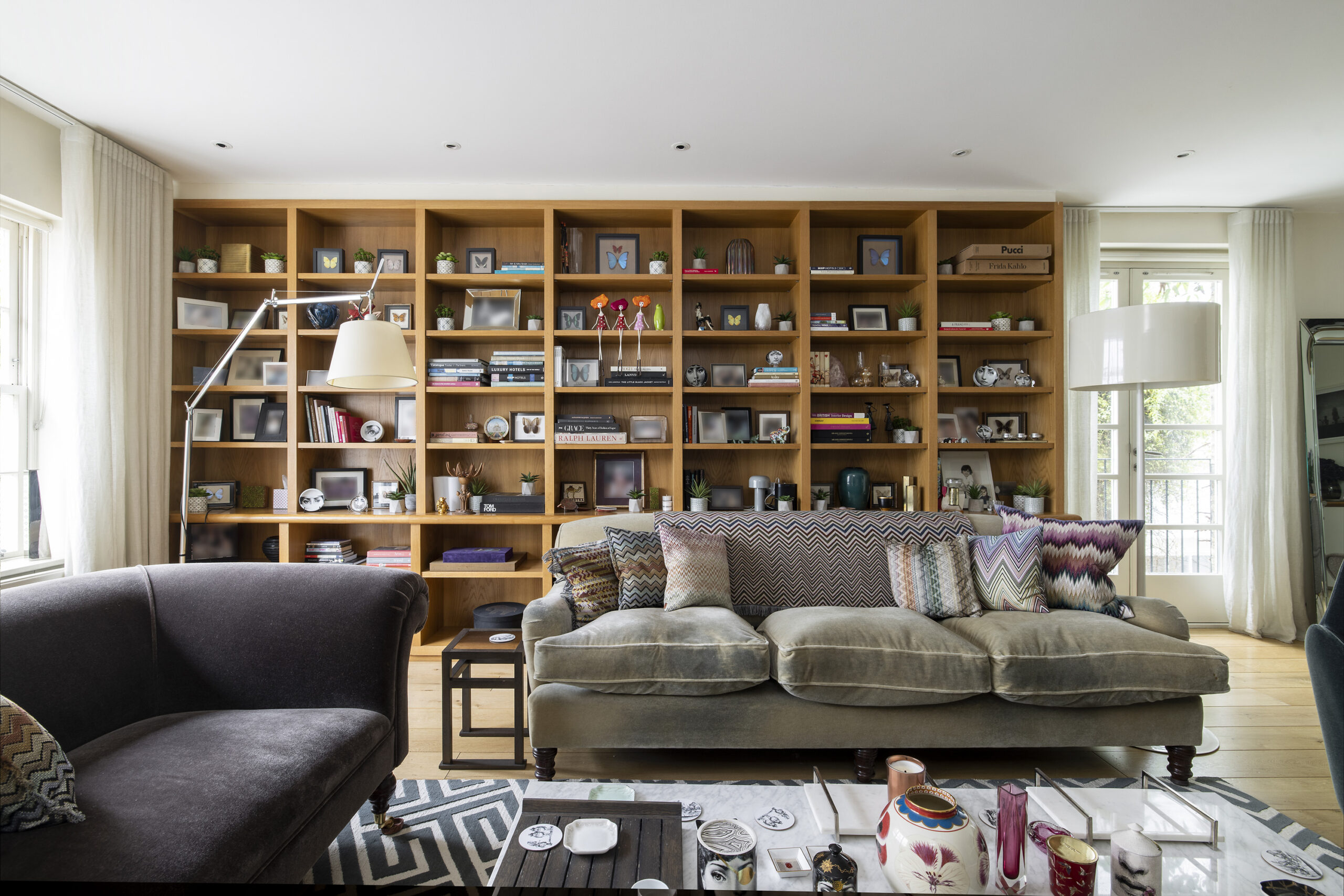 For Rent, Horbury Mews Notting Hill W11 wooden bookcases with books and grey sofa