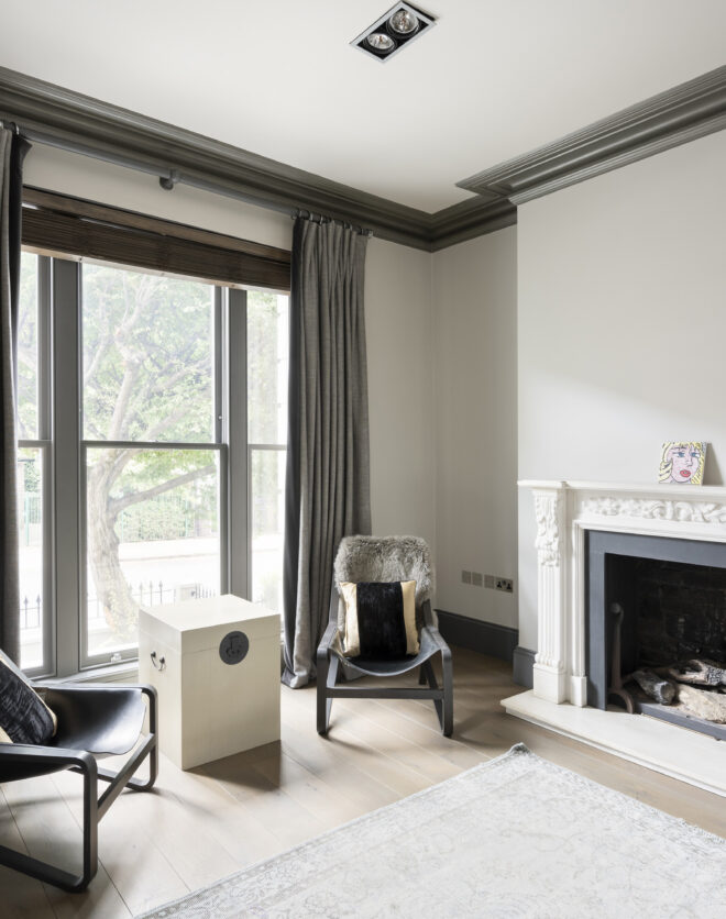 Double reception room with fireplace in a four-bedroom stucco-fronted townhouse for sale