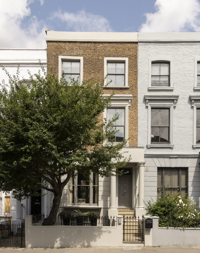 Traditional stucco-fronted exterior of a four-bedroom townhouse for sale in Notting Hill