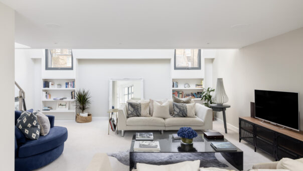 Bright neutral reception room of a three-bedroom mews house for sale in Notting Hill