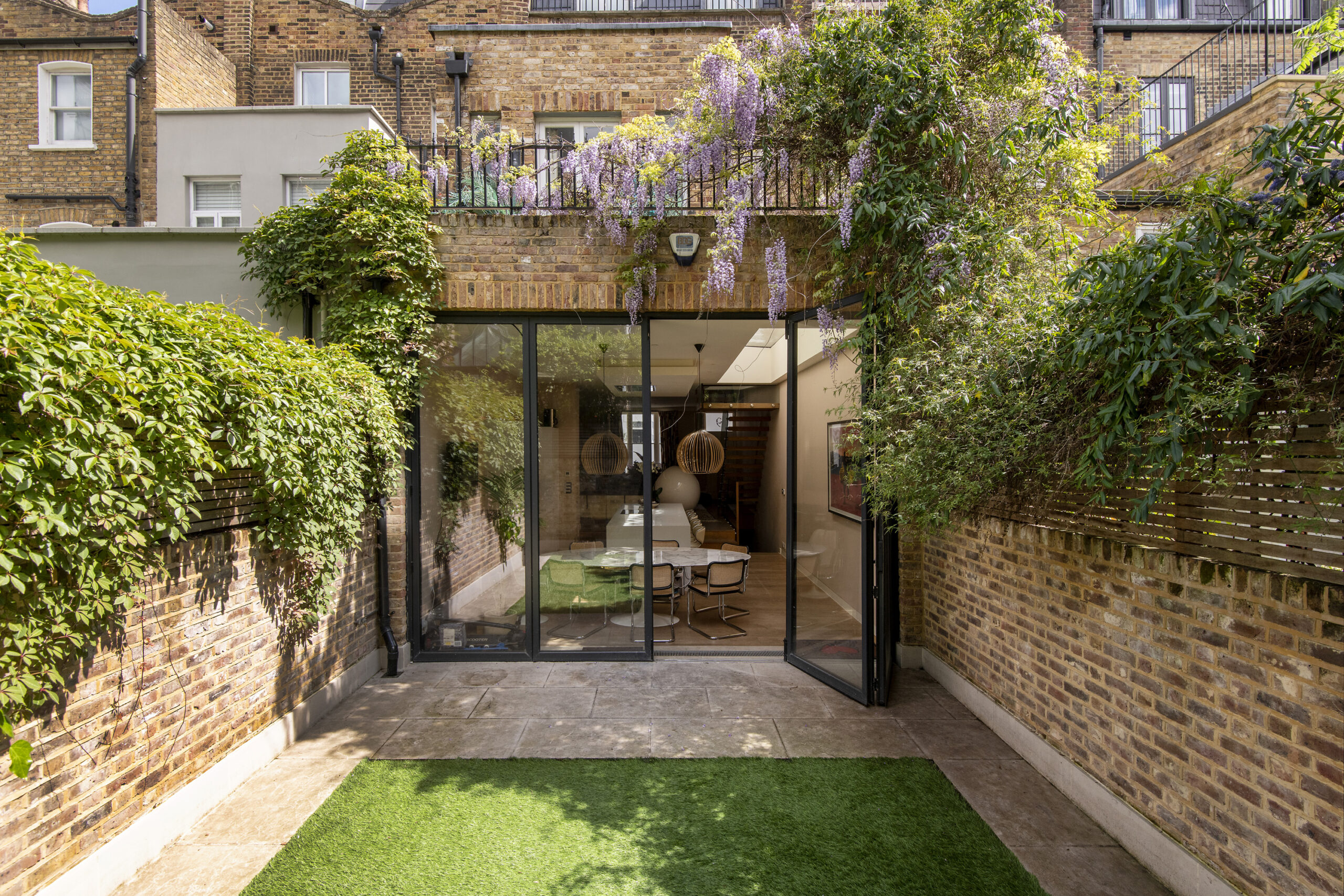 Enclosed private garden of a four-bedroom Notting Hill townhouse for sale.