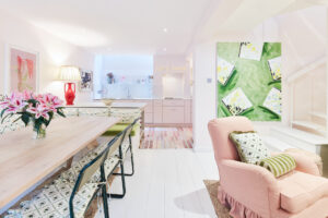 For Sale, Hippodrome Mews Holland Park W11 living and dining room with pink walls and colourful furniture