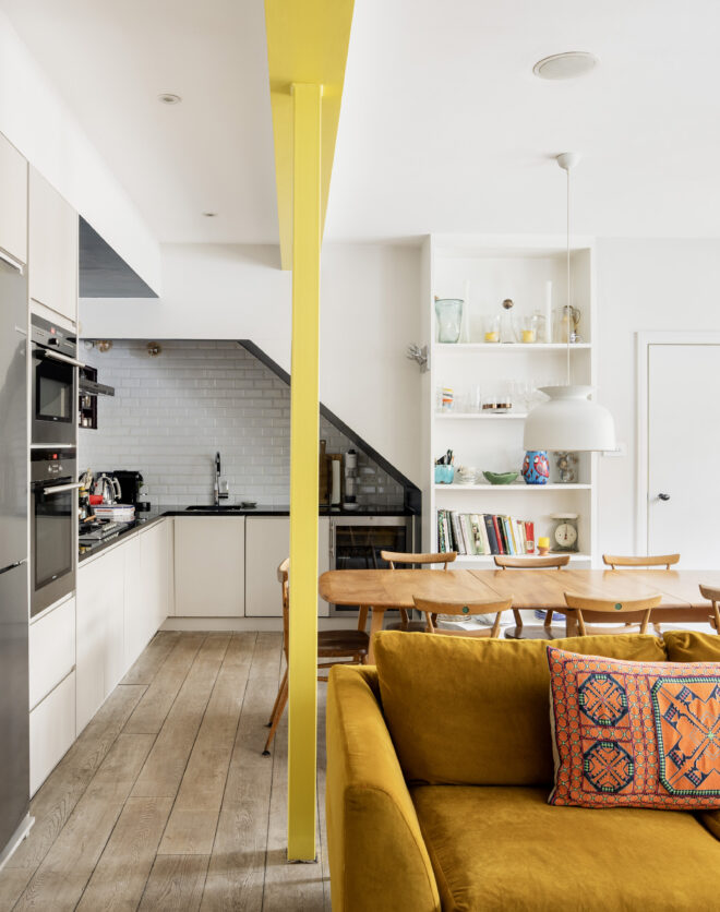 Brightly designed open-plan kitchen, dining and living room of a two-bedroom mews home for sale in Notting Hill