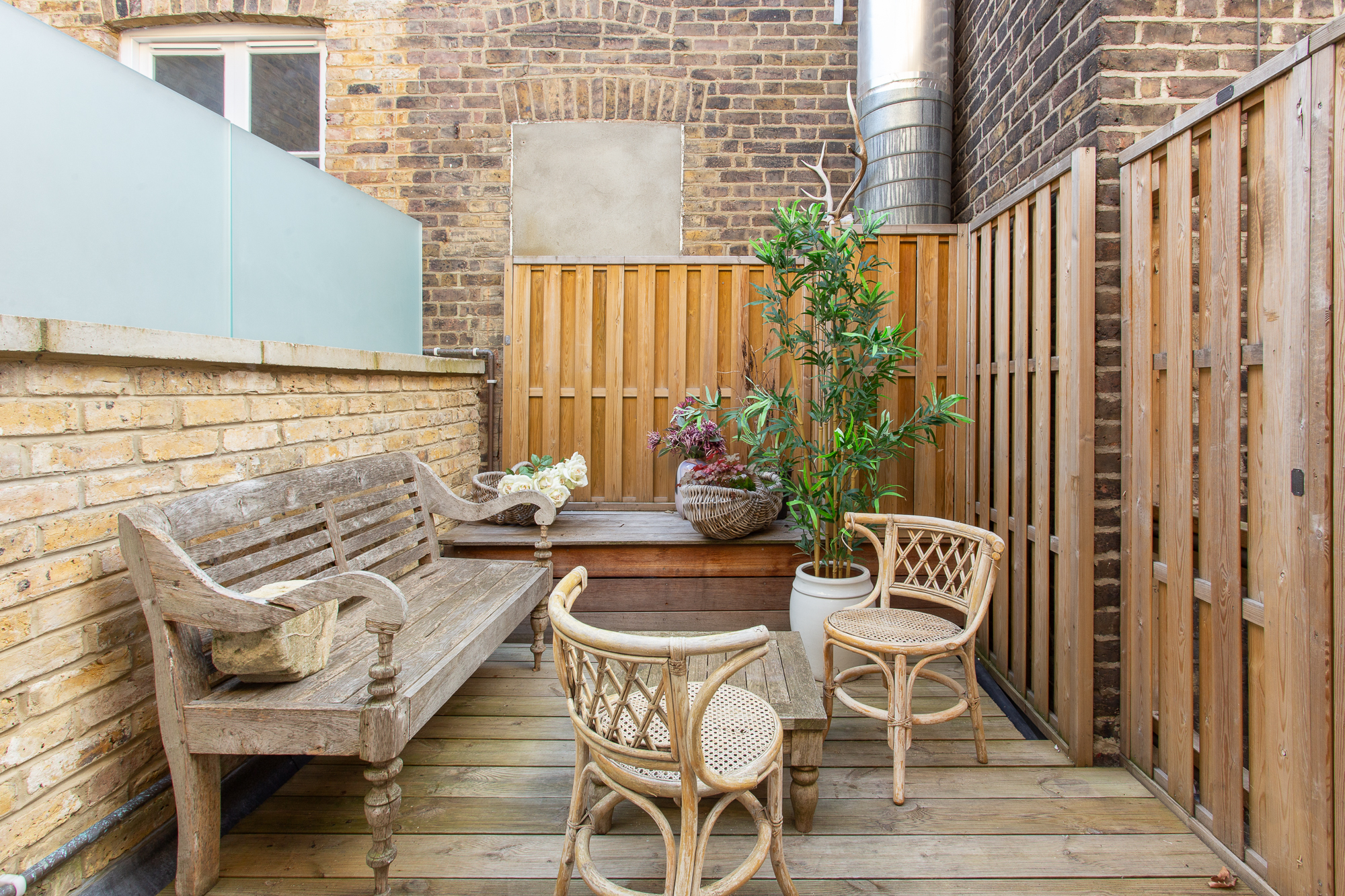 Quiet decked garden of a luxury two-bedroom house for sale in Notting Hill