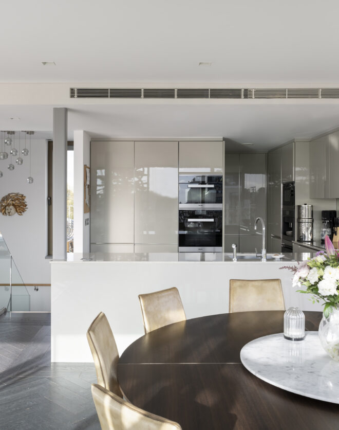 Modern kitchen and dining area of a luxury penthouse apartment for sale on Westbourne Grove