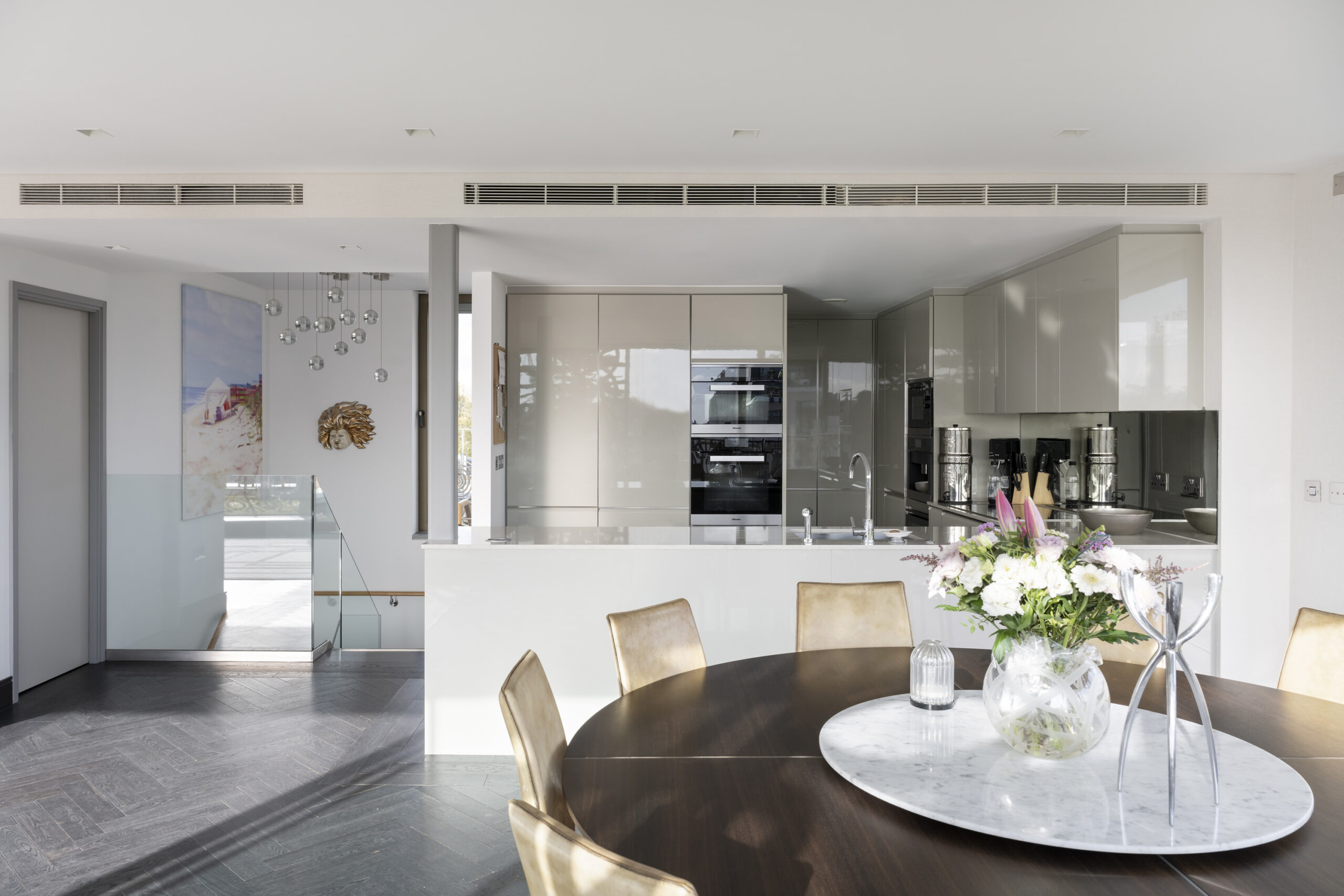 Modern kitchen and dining area of a luxury penthouse apartment for sale on Westbourne Grove