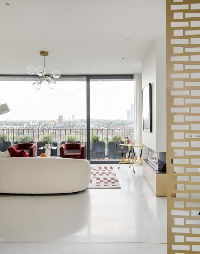 Luxury reception room with glass doors to a roof terrace in a three-bedroom penthouse apartment for rent in White City