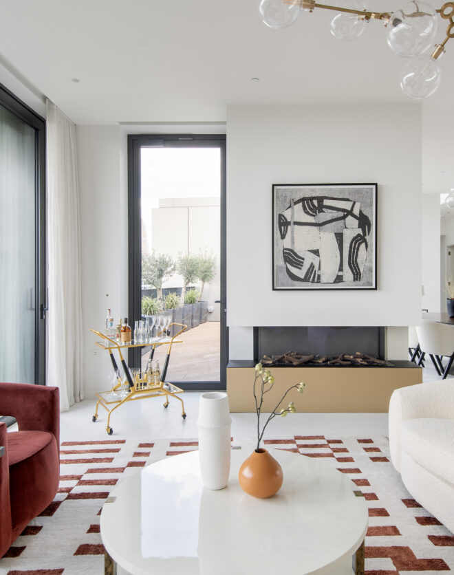 Luxury reception room with glass doors leading to a roof terrace in a three-bedroom penthouse apartment for rent in White City