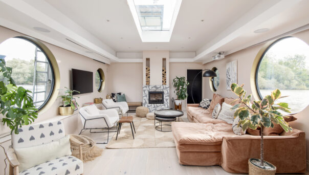 Luxury pastel coloured open-plan interiors of a house boat for sale