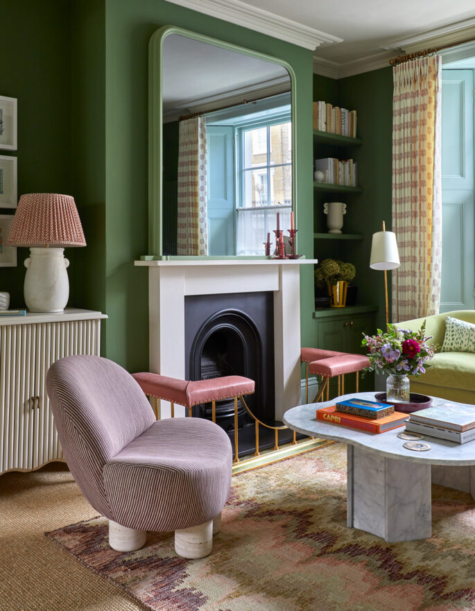 Fireplace in a green-painted living room