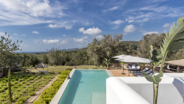 View of Ibiza Finca Swimming Pool over verdant coutryside