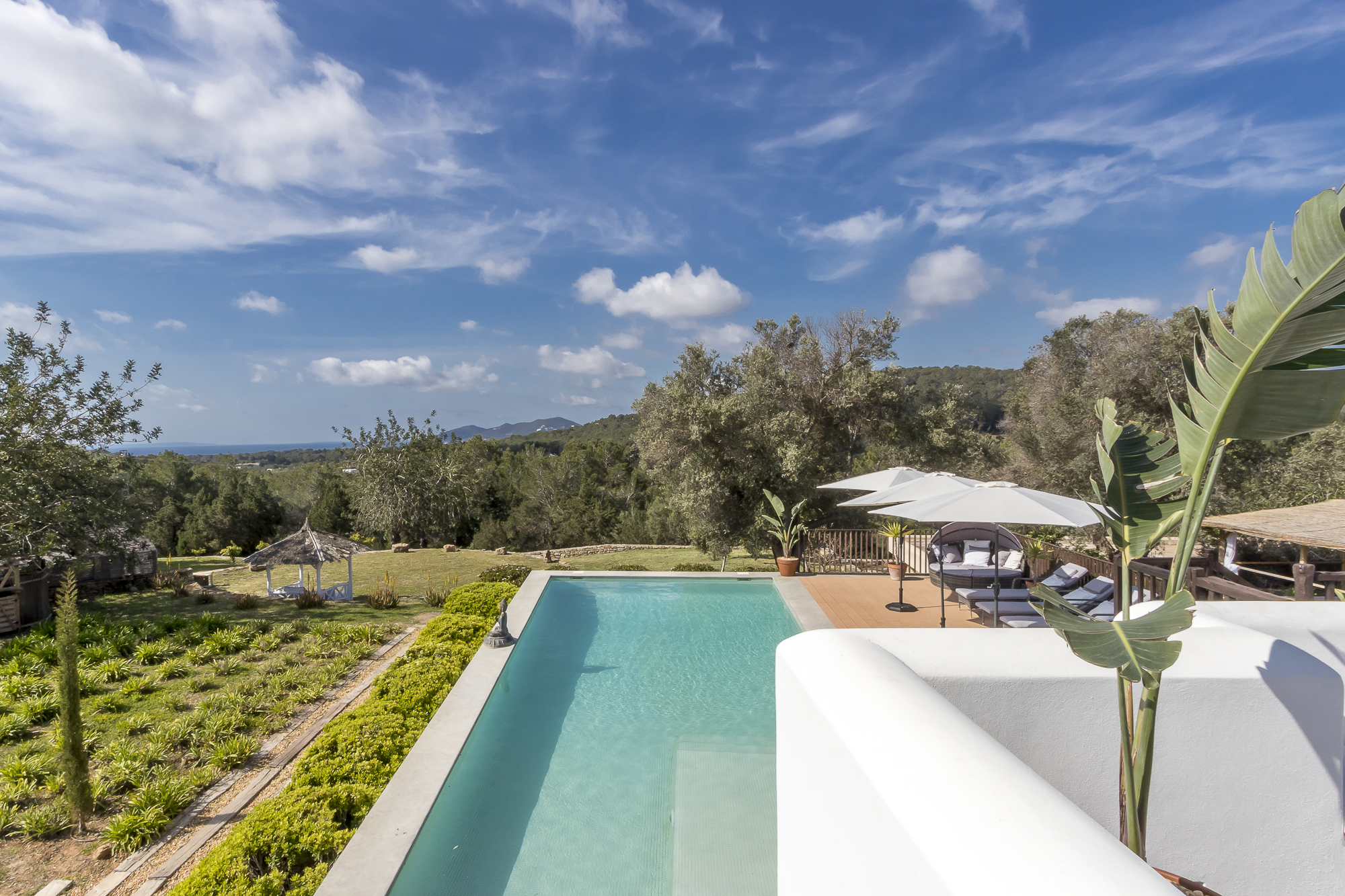 View of Ibiza Finca Swimming Pool over verdant coutryside
