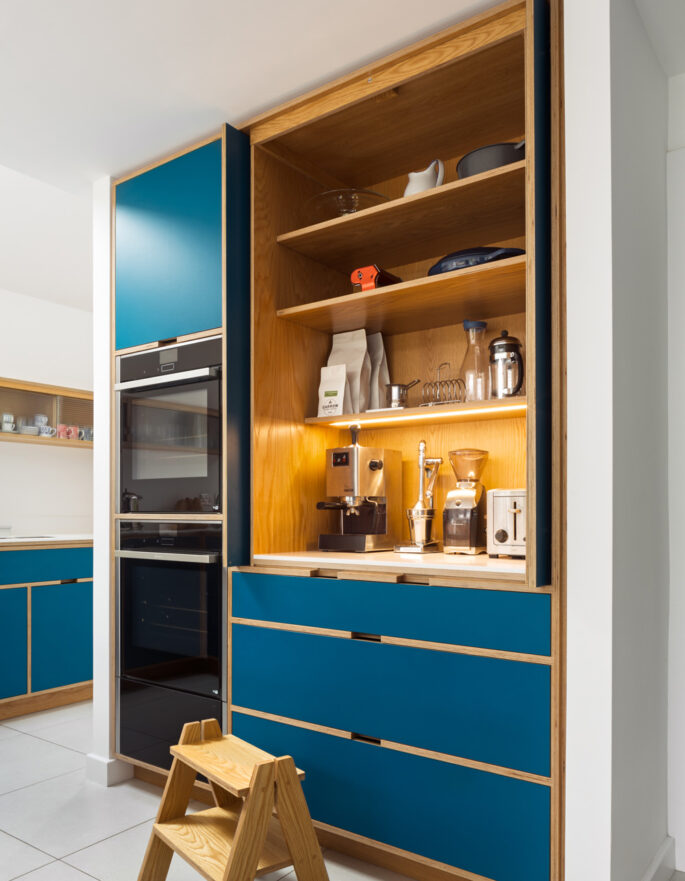 Blue kitchen shelving by Uncommon Projects