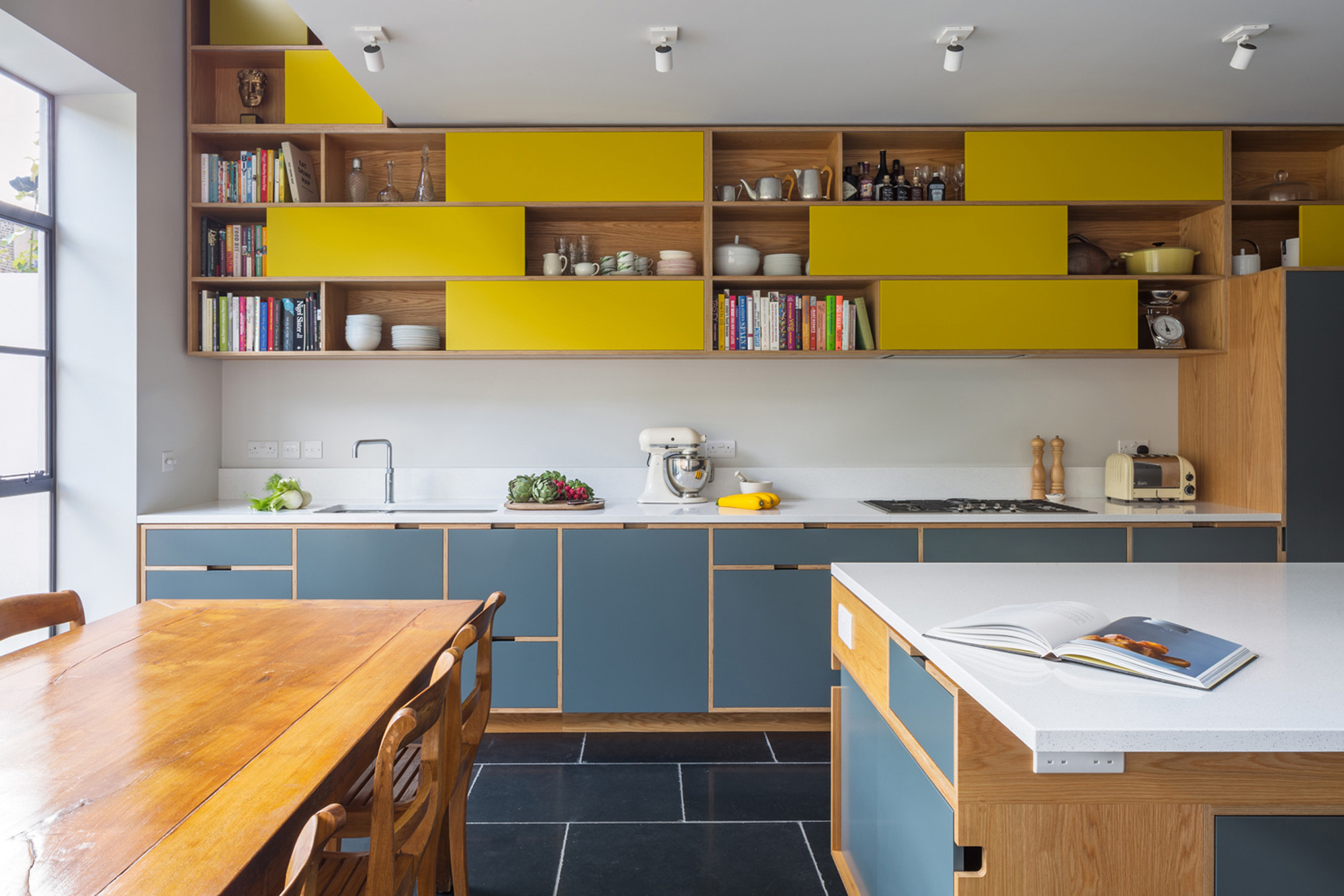 Yellow and blue cabinets by Uncommon Projects