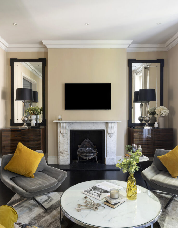 Luxury reception room with feature fireplace in a three-bedroom maisonette for sale