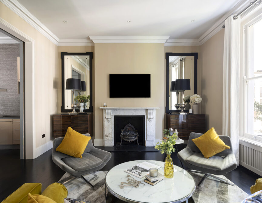 Luxury reception room with feature fireplace in a three-bedroom maisonette for sale