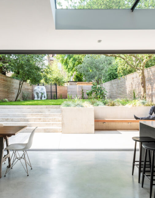 A large, modern kitchen extension with concrete flooring