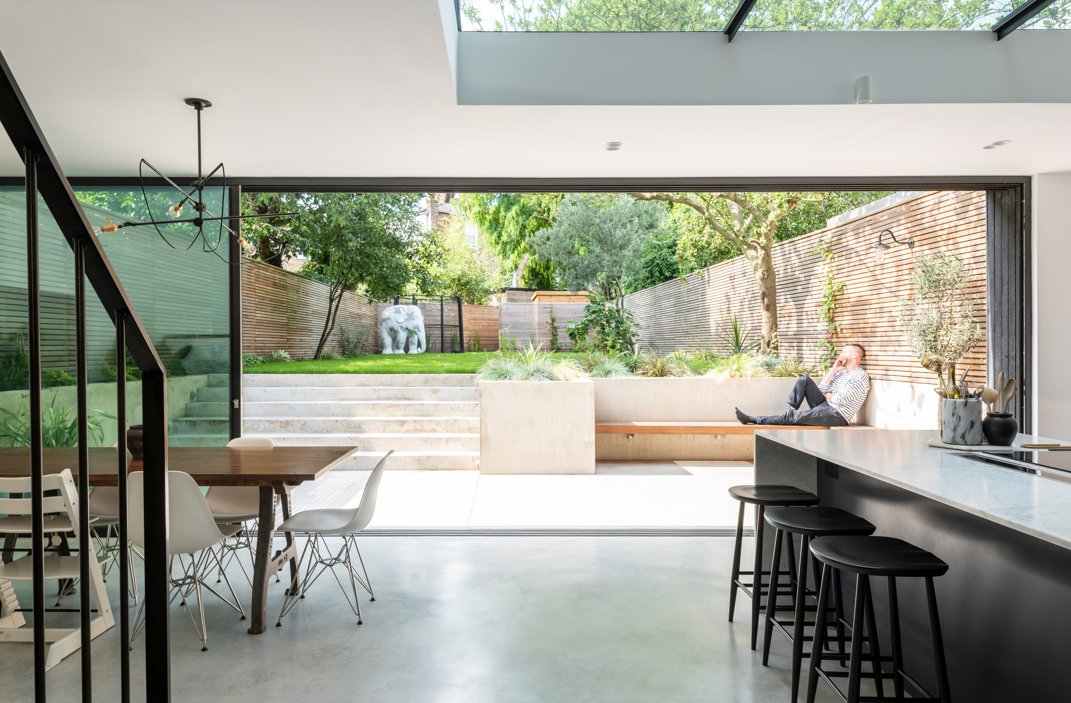 A large, modern kitchen extension with concrete flooring