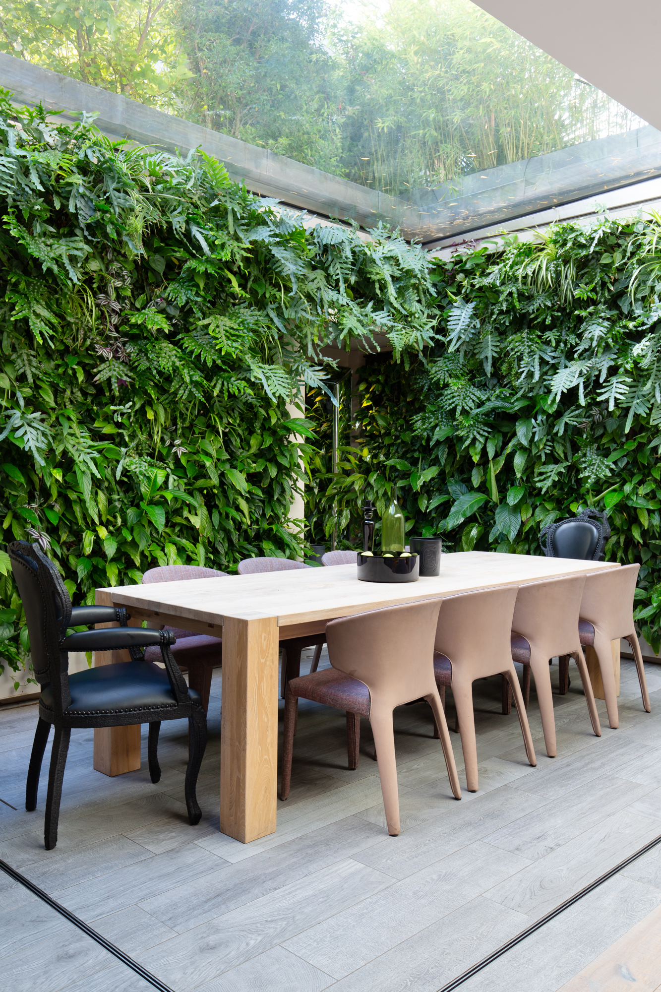Westbourne Grove&#039;s Indoor dining area with skylight and planters